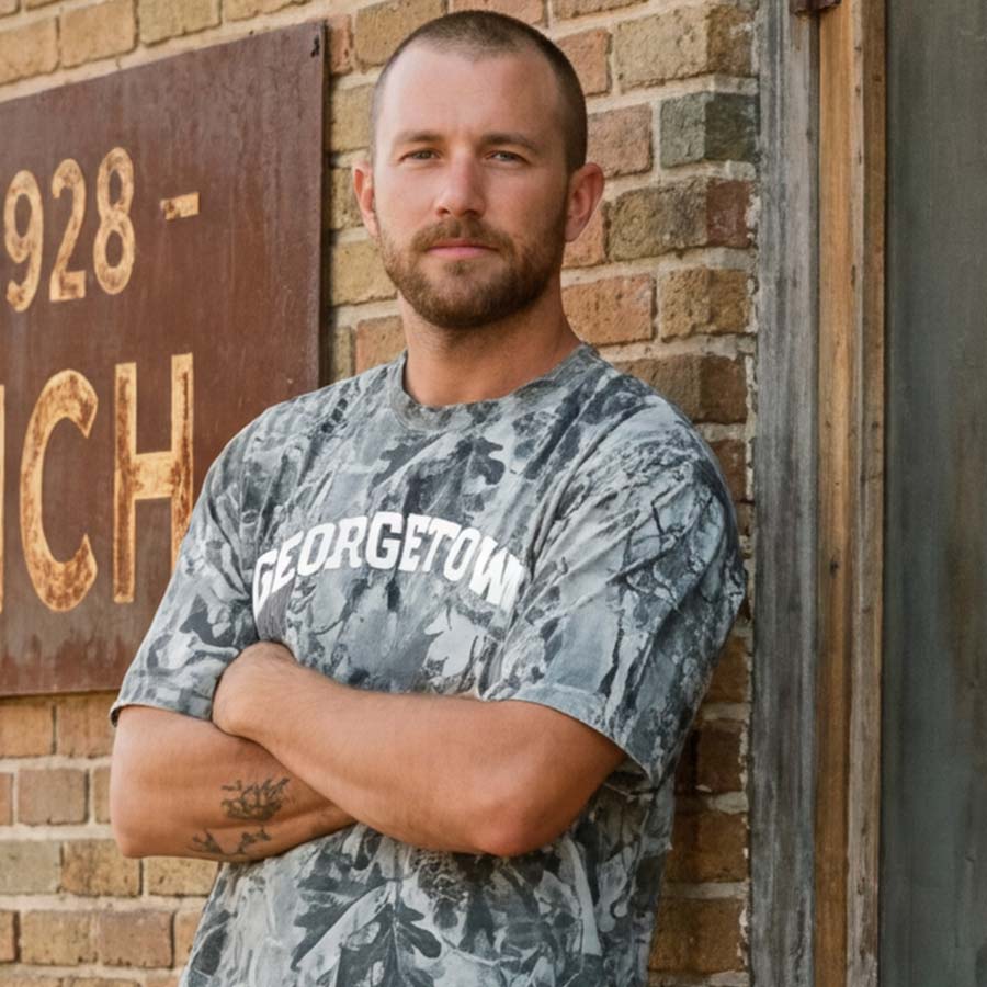 Model wearing Georgetown TX camo shirt heavyweight oversized cotton t-shirt with arched lettering