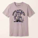 Front studio view of the BELLA+CANVAS 3001 Pink Gravel Always a Little Wild mushroom graphic tee.