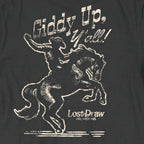 Close-up of the distressed cream cowboy and bucking horse artwork on the back of the Giddy Up, Y'all Jersey Tee.