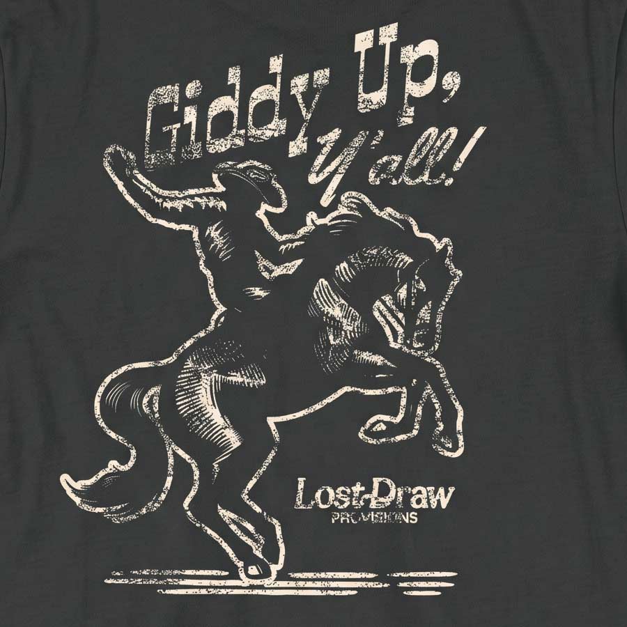 Close-up of the distressed cream cowboy and bucking horse artwork on the back of the Giddy Up, Y'all Jersey Tee.