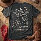 Dark Grey Giddy Up, Y'all Jersey Tee displayed with Western accessories, featuring the distressed cowboy and bucking horse back graphic.