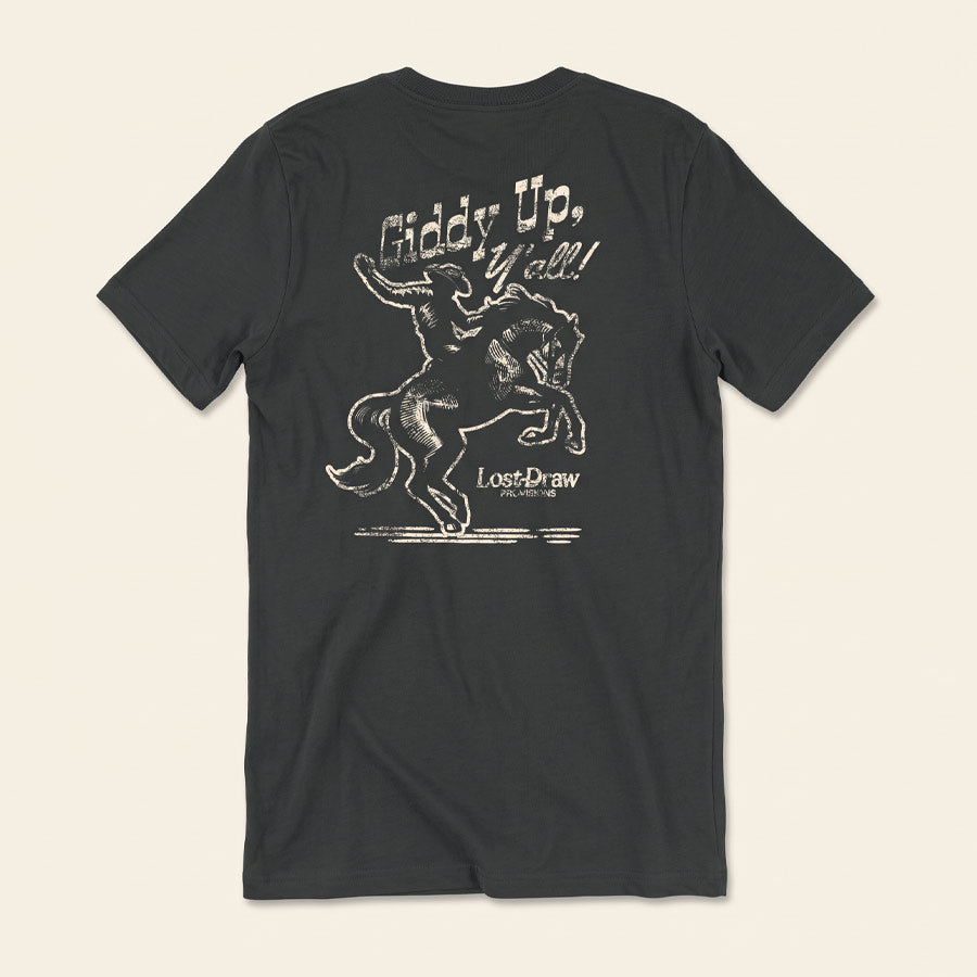 Back of the Giddy Up, Y'all Jersey Tee featuring a vintage cowboy riding a bucking horse in distressed cream ink.