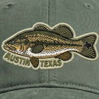 Green cap with a fish patch and 'Austin Texas' text on a matching green background