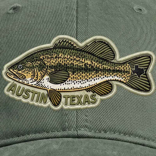 Green cap with a fish patch and 'Austin Texas' text on a matching green background