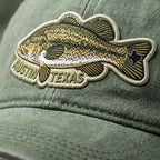 Green cap with a fish-shaped patch featuring 'Austin Texas'