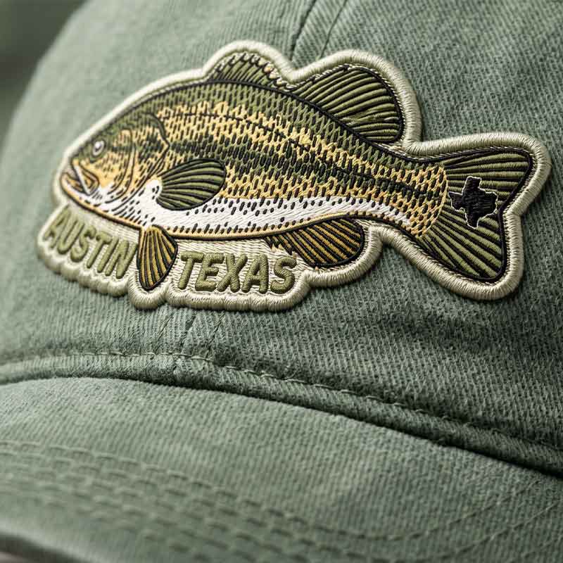 Green cap with a fish-shaped patch featuring 'Austin Texas'
