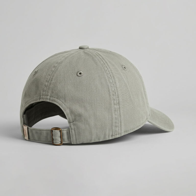 Green baseball cap on a light gray background