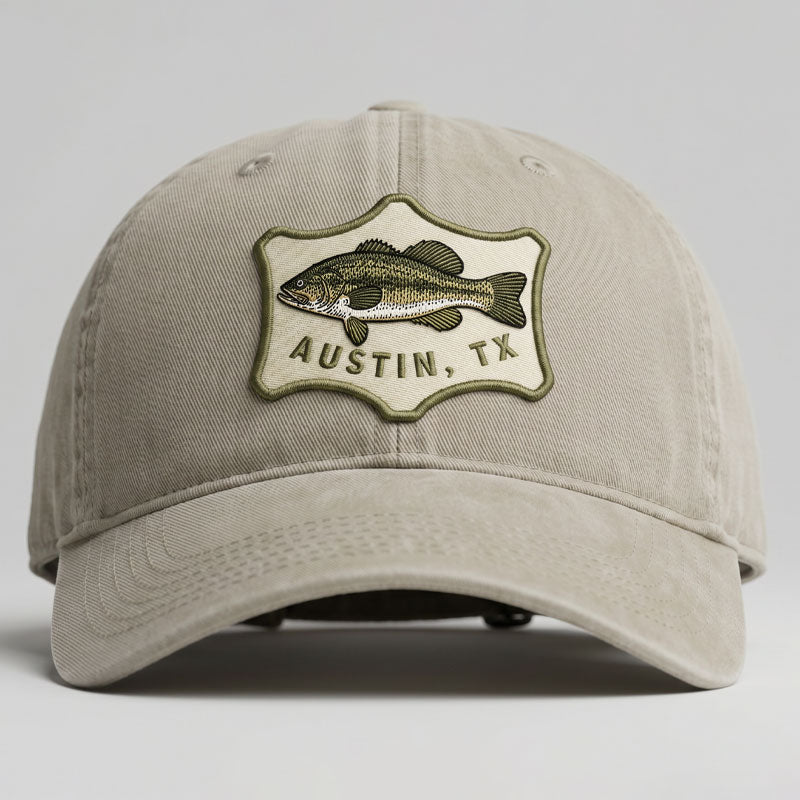 Beige cap with fish emblem and 'Austin, TX' text on a gray background