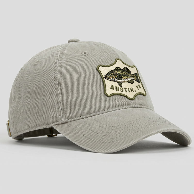 Gray cap with a fish emblem and 'Austin, TX' text on a light gray background
