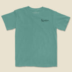 Flay lay front of Soaring hawk Texas graphic printed on light green t-shirt by Lost Draw Provisions