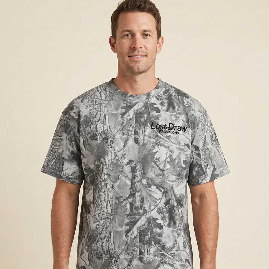 Front of model wearing Western bison t-shirt vintage camo oversized heavyweight cotton tee