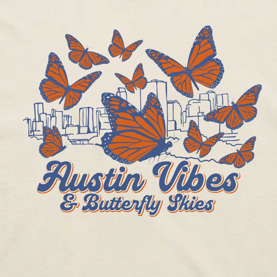 Close-up of butterfly graphic with Austin skyline illustration
