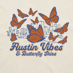 Close-up of butterfly graphic with Austin skyline illustration