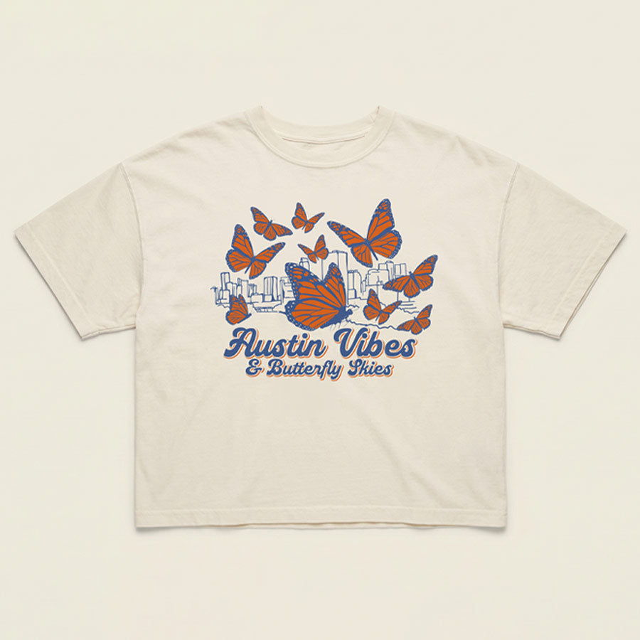 Flat lay of Women’s boxy tee in natural cotton with orange butterfly design