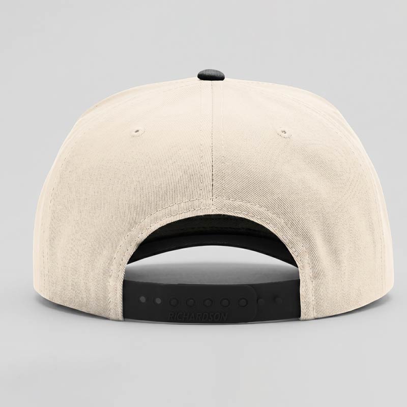 Beige cap with black interior and brim on a gray background