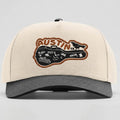 Beige and gray cap with 'Austin, TX' logo on a light gray background
