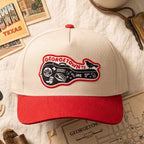 Cap with Georgetown, TX patch on a textured surface with vintage books and maps.