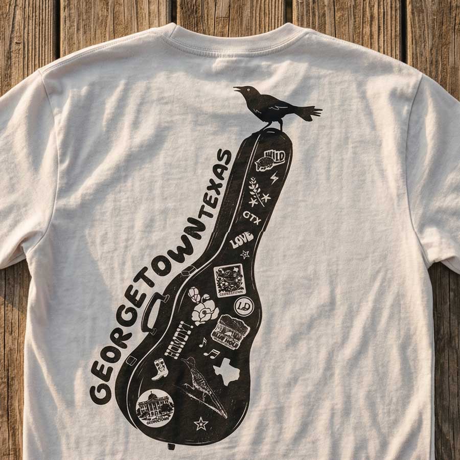Heavyweight oversized Georgetown Texas t-shirt dirty white graphic tee flat lay on a dock