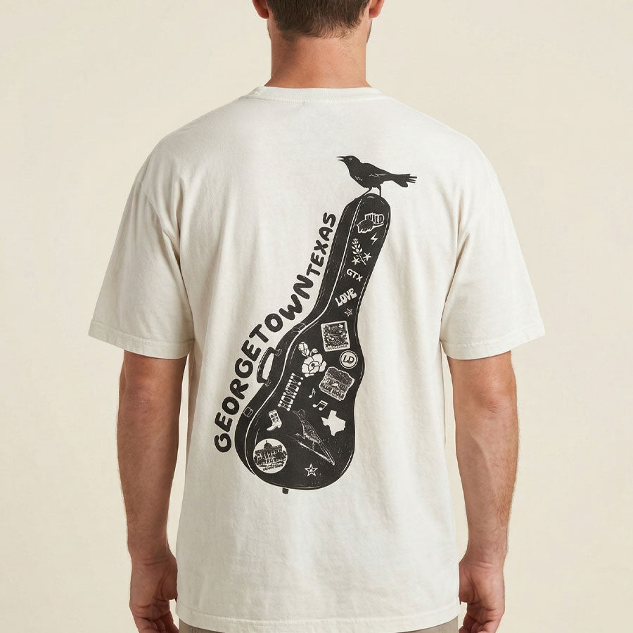 Back view of man wearing Texas souvenir graphic tee Georgetown guitar case design oversized shirt