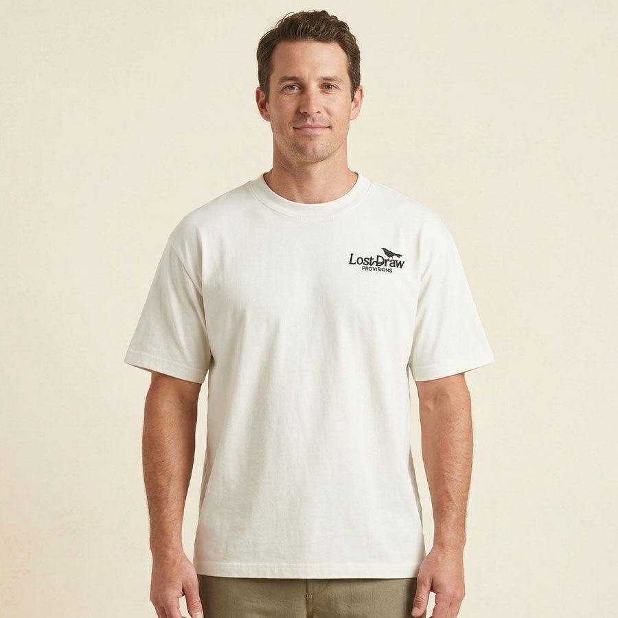 Front view of man wearing Texas souvenir graphic tee Georgetown guitar case design oversized shirt