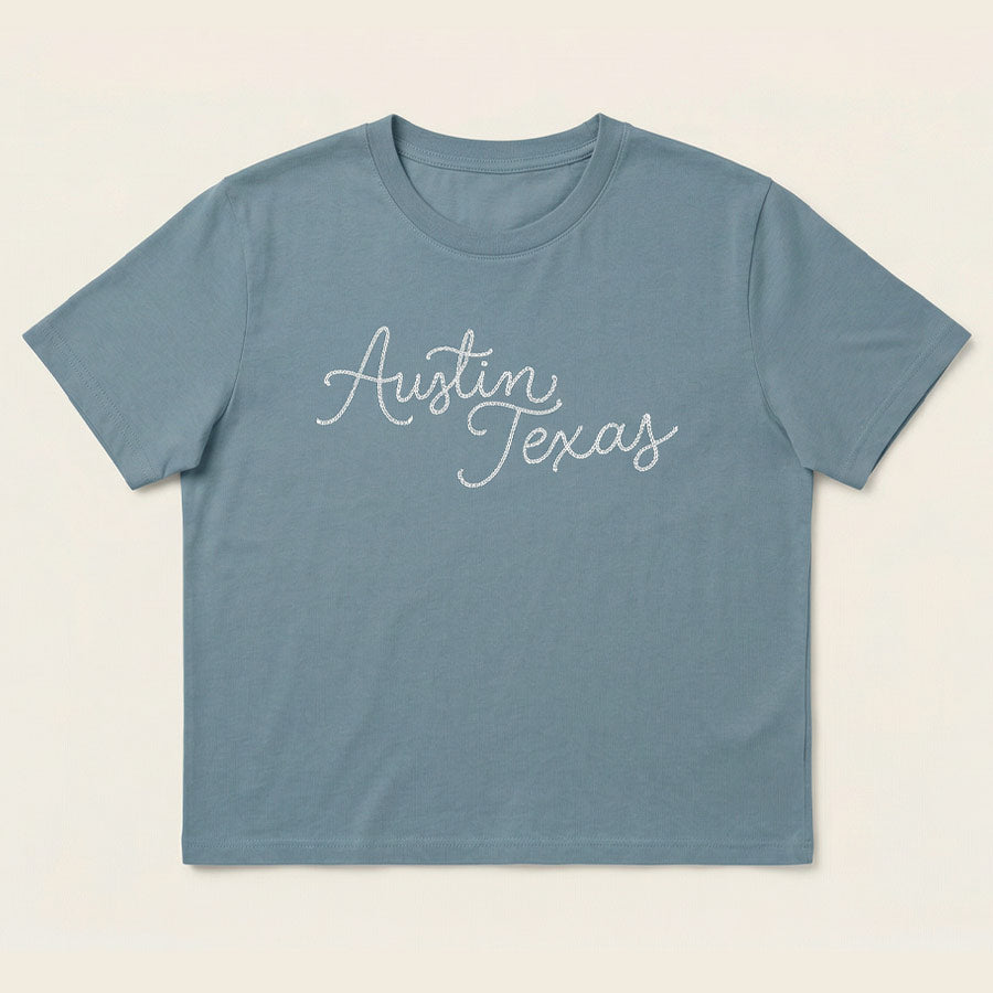 Flay lay front view of Chainstitch Austin women’s heavyweight t-shirt
