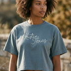 Lifestyle image of woman wearing relaxed fit Austin script tee
