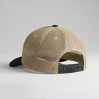 Beige mesh cap with black brim on a light gray background
