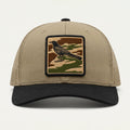 Beige cap with a bird patch on a white background