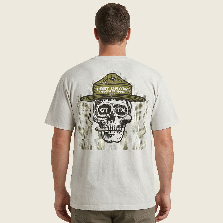 Back view of model wearing Georgetown TX ranger skull graphic tee dirty white oversized fit shirt