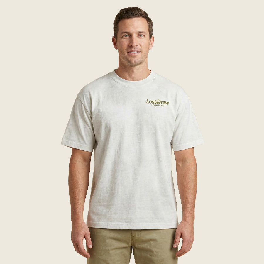 Front view of model wearing Georgetown TX ranger skull graphic tee dirty white oversized fit shirt