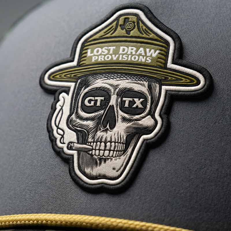 Patch with skull design and 'Lost Draw Provisions' text on a dark background