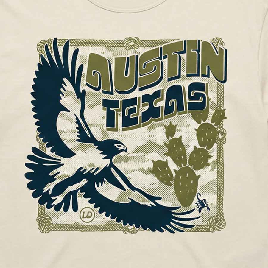 Close-up of Hawk & Thorn graphic featuring hawk and desert cactus design