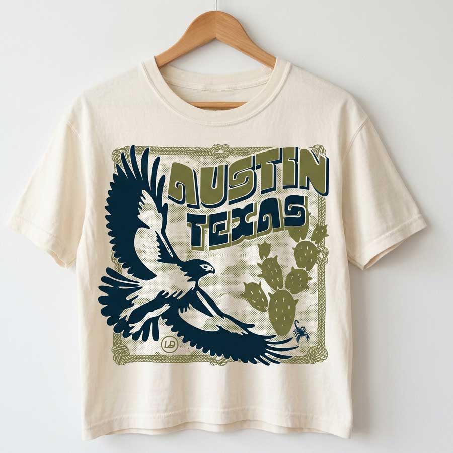 Front view of Hawk & Thorn women’s graphic t-shirt on vintage white tee on hanger