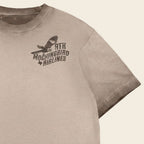 Close-up of Mockingbird Express Austin Texas front chest screen print on Chocolate Oil Wash heavyweight T-shirt