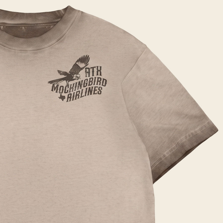 Close-up of Mockingbird Express Austin Texas front chest screen print on Chocolate Oil Wash heavyweight T-shirt