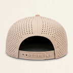 Perforated beige cap on a light beige background