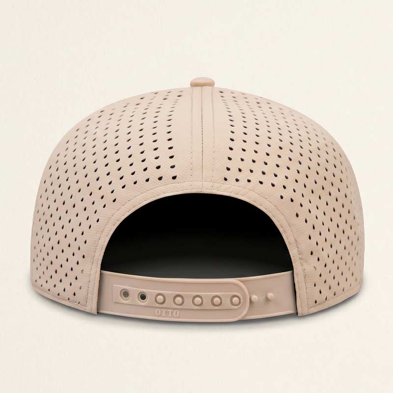 Perforated beige cap on a light beige background