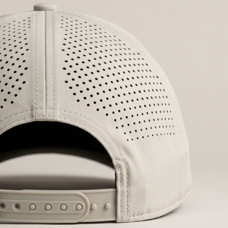 Perforated beige cap back on a putty background