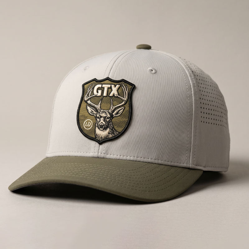 Putty and olive Lost Draw Provisions performance hat with UV printed embroidered-look GTX deer crest patch on Imperial performance cap.