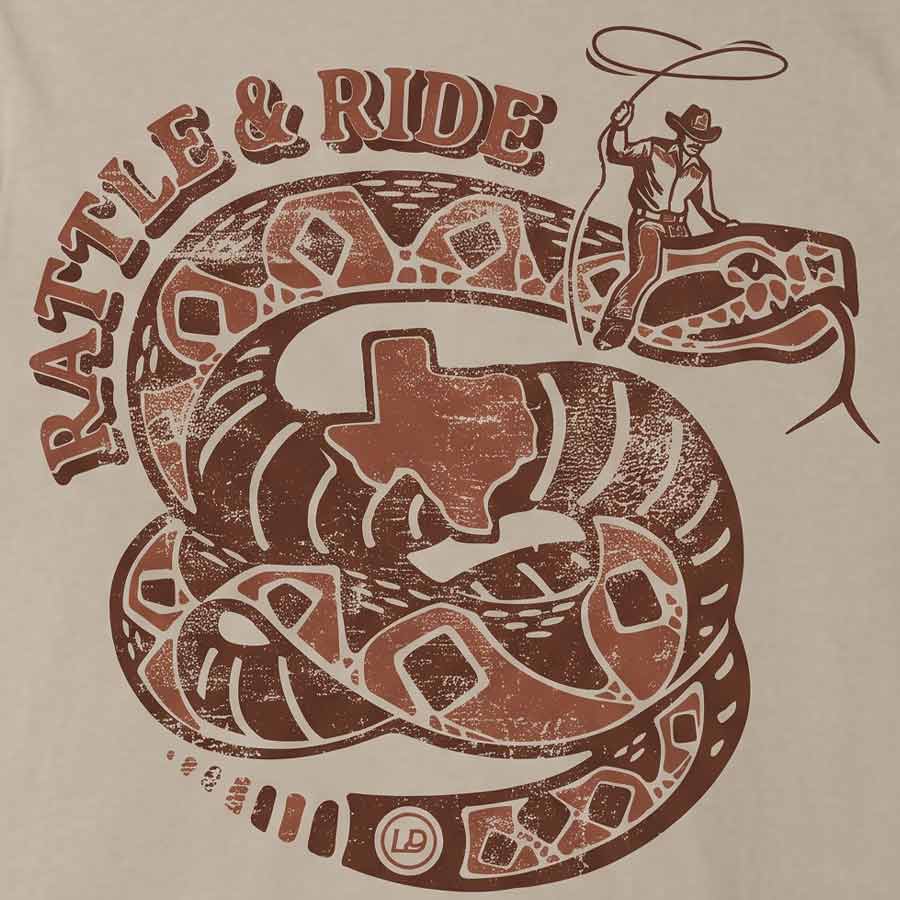 Close-up of the distressed rust-brown rattlesnake, Texas silhouette, and cowboy artwork on the Rattle & Ride Tee.