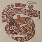 Close-up of the distressed rust-brown rattlesnake, Texas silhouette, and cowboy artwork on the Rattle & Ride Tee.