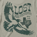 Back of the back Lost Hawk Jersey Tee featuring distressed forest-green hawk illustrations, vintage Lost Draw Provisions lettering, and Texas artwork on a Thyme green shirt.