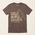 Front of the Wild Bird Society Jersey Tee in Cocoa featuring a distressed cream bird illustration and vintage lettering.